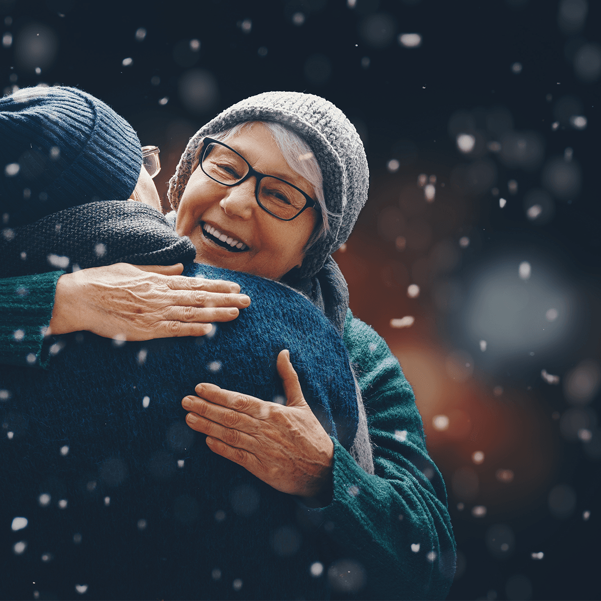 People hugging in the snow