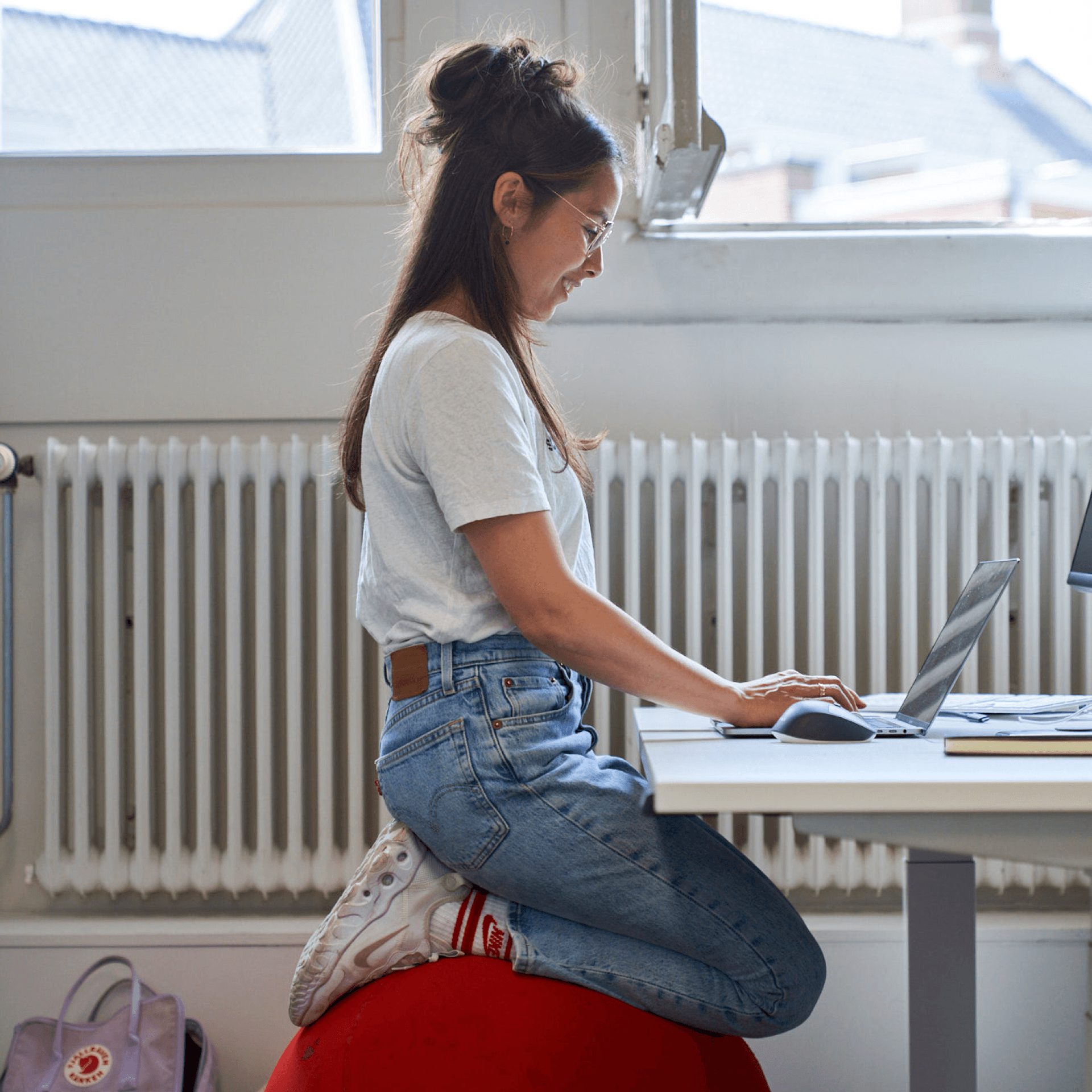Woman sitting on a ball