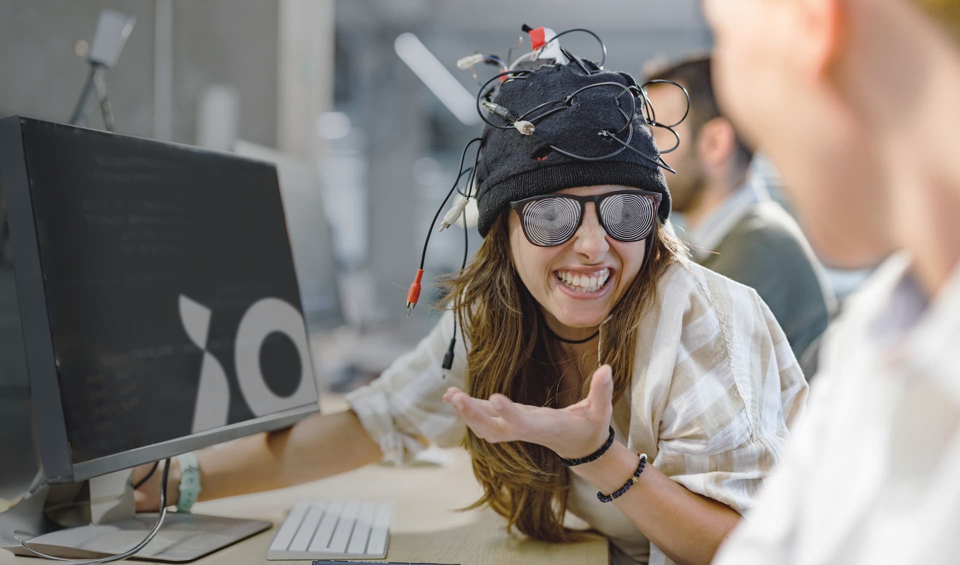 Creative person smiling at desk
