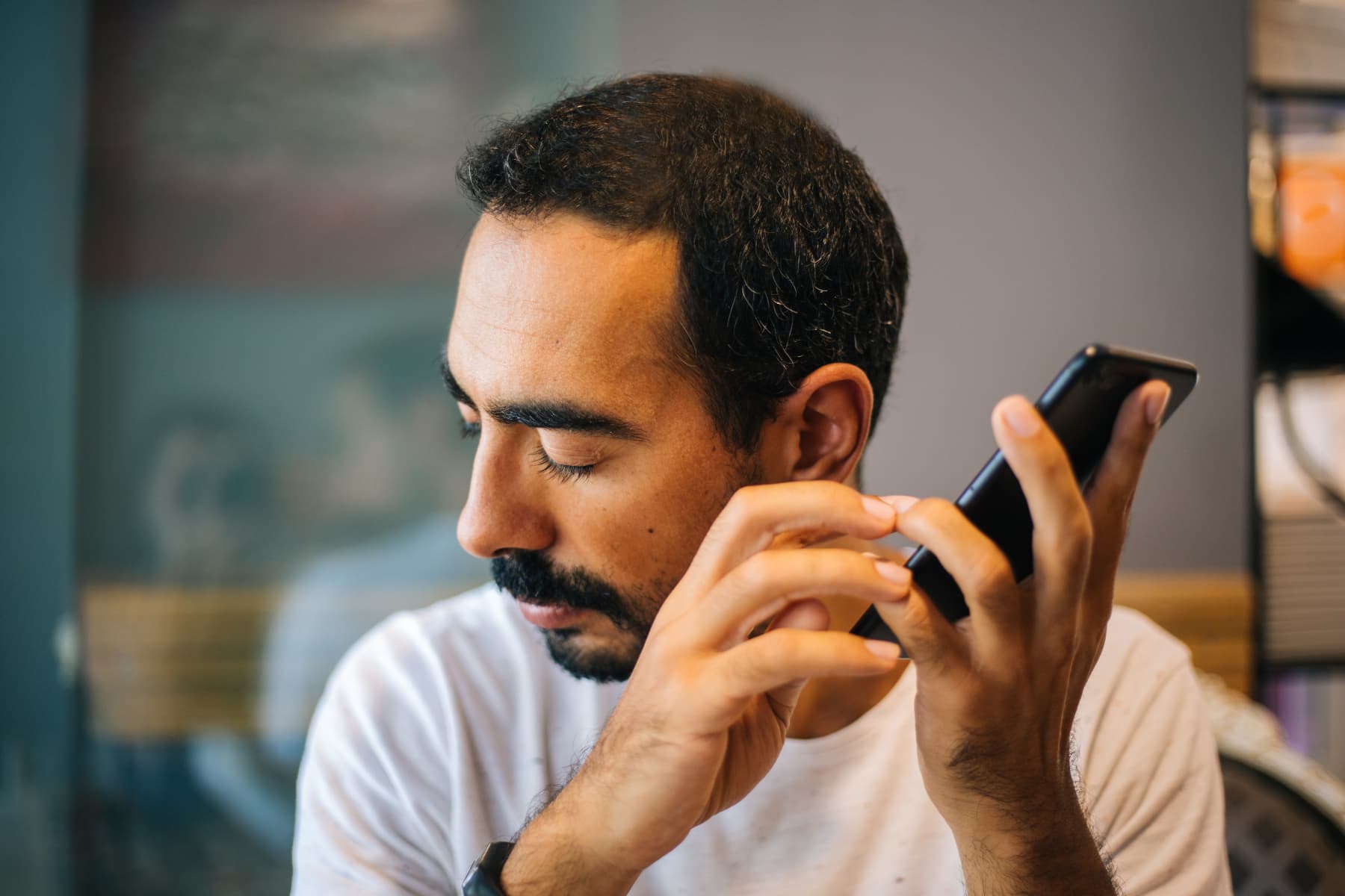 man listening to content on phone