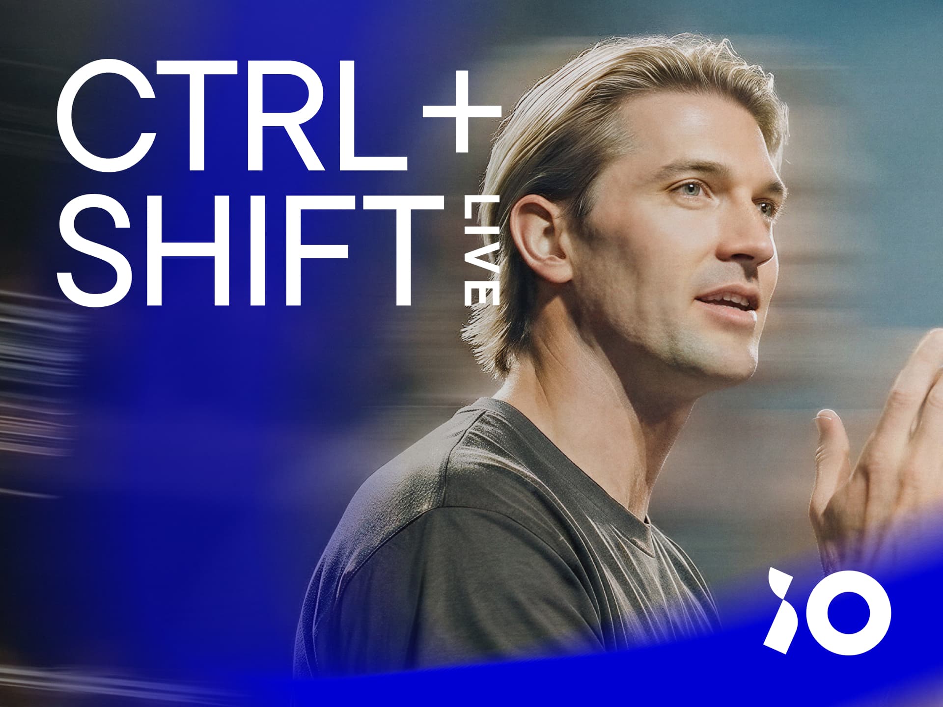 Person speaking in front of a blurred background with "CTRL + SHIFT Live" text; logo in lower right corner.