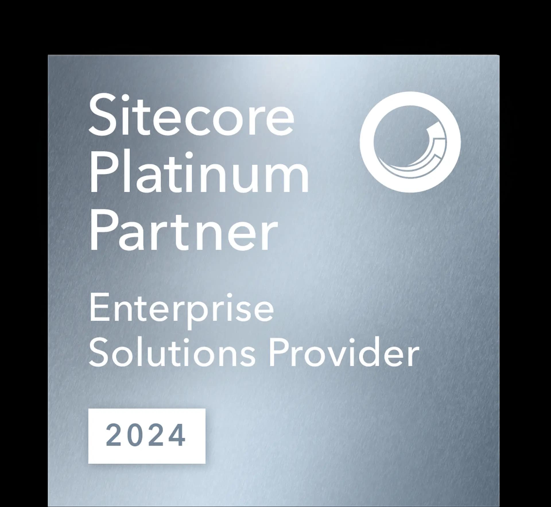 Metallic plaque reading "Sitecore Platinum Partner, Enterprise Solutions Provider, 2024," with a circular logo.