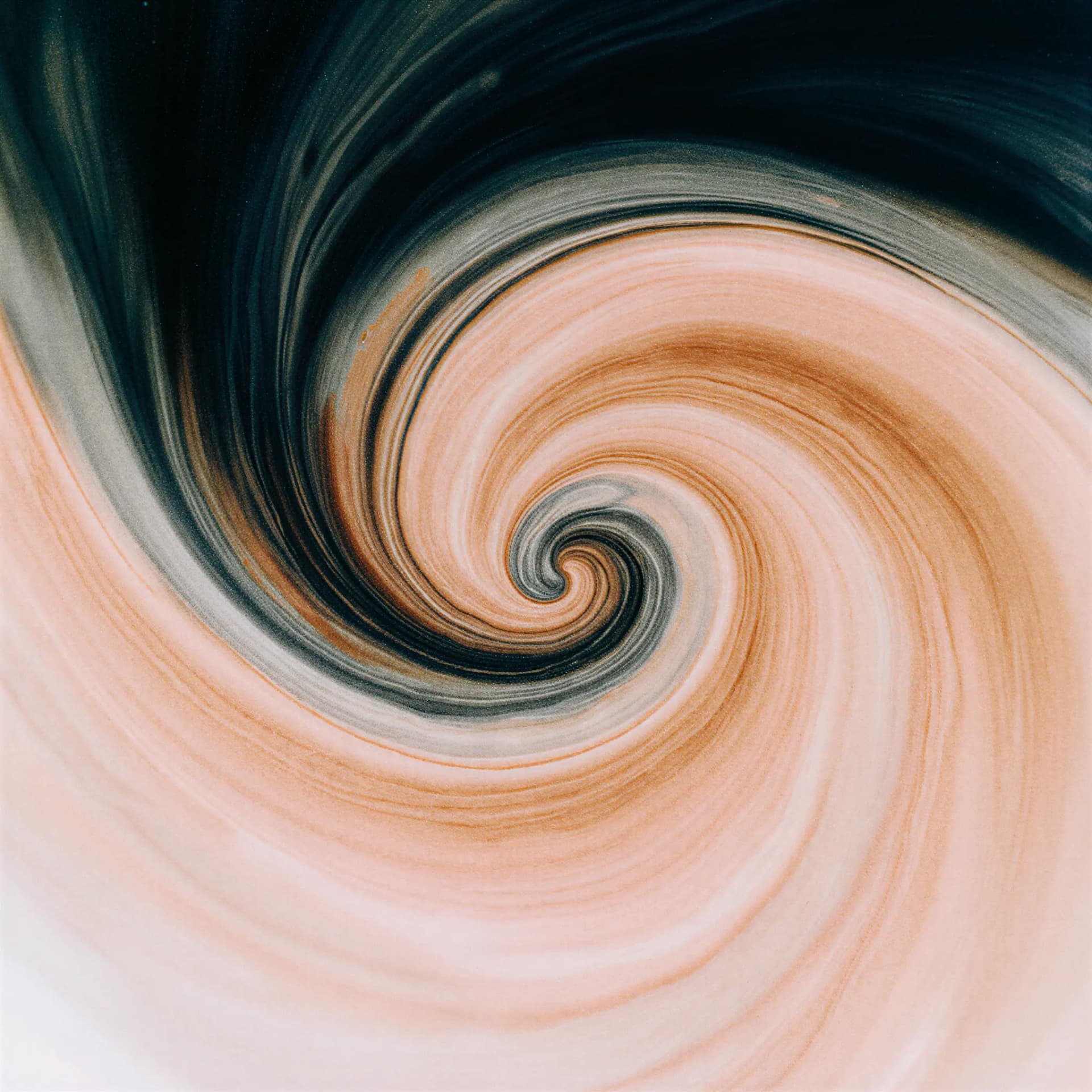 Abstract swirl pattern in beige, brown, and black tones, resembling a whirlpool or vortex.