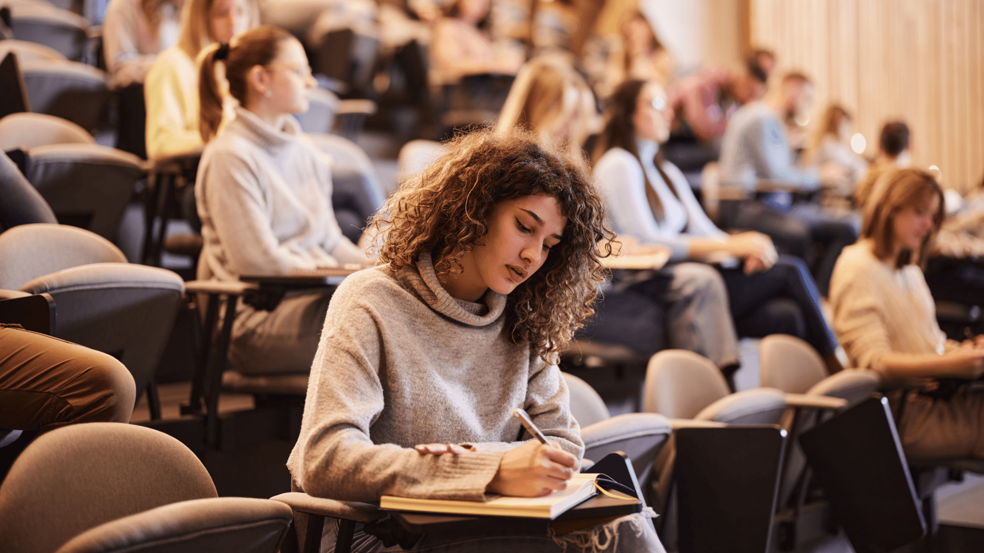 Girl taking notes during class